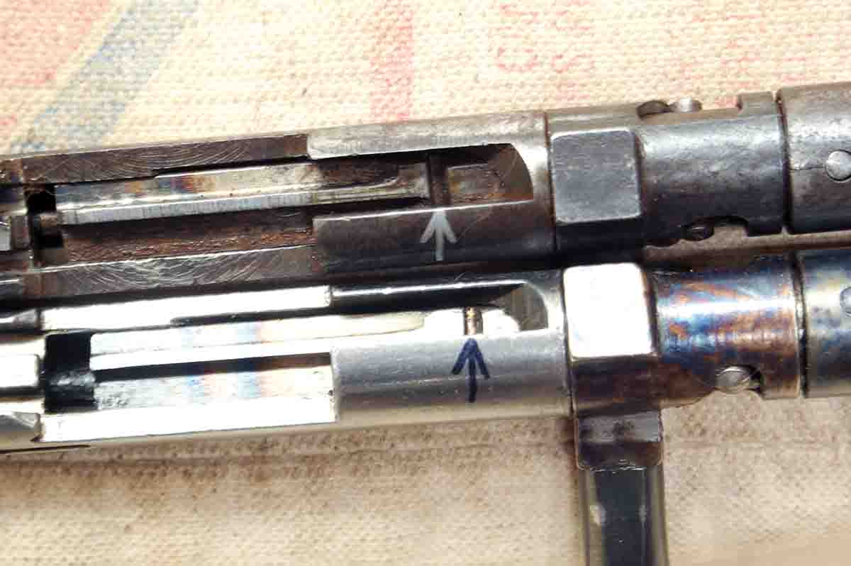 The sear notch in the firing pin is farther forward on the top bolt having worn the cocking surfaces. The bottom bolt is nearly new.